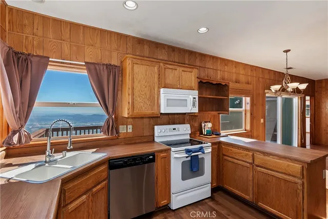 a kitchen that has a sink and a stove