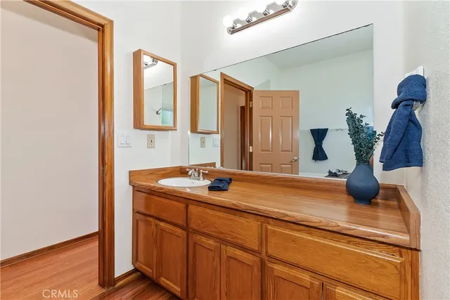 a room with a table chairs and a wooden floor