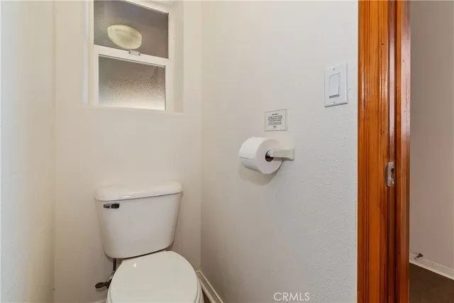 an aerial view of a house with yard and outdoor seating
