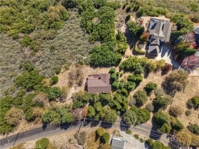 an aerial view of a house with mountain view