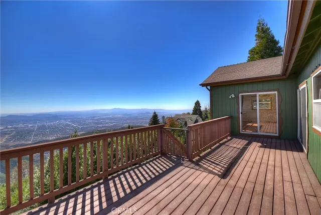 a view of a balcony with wooden floor