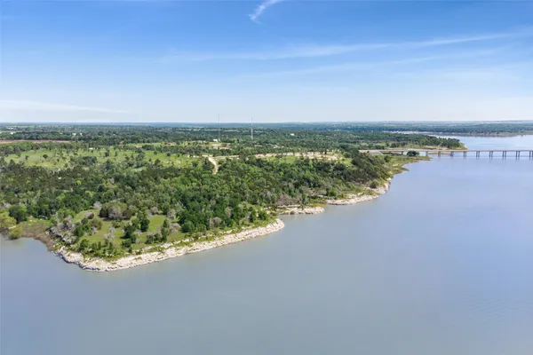 a view of a field with an ocean