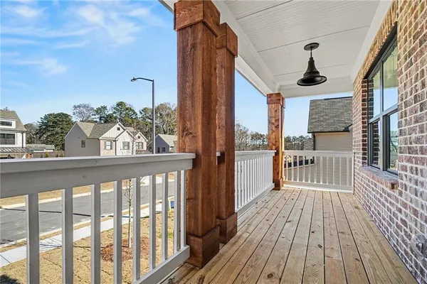 a view of a balcony with wooden floor