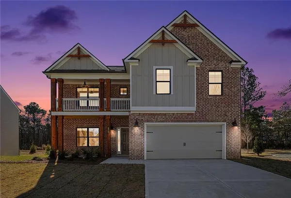 a front view of a house with yard