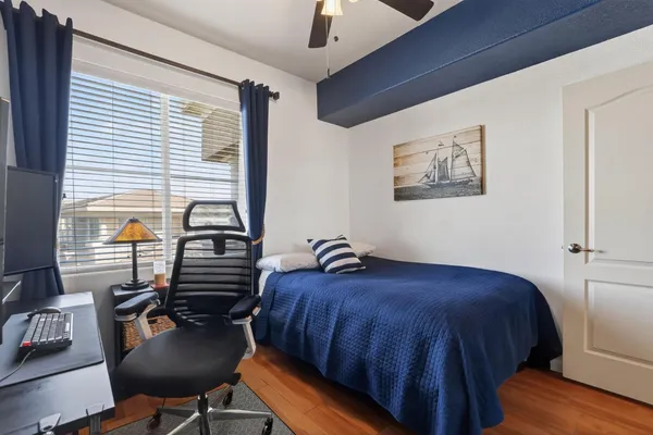 a bedroom with furniture and a window