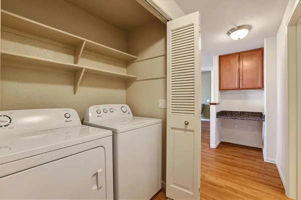 a view of storage and utility room with washer and dryer