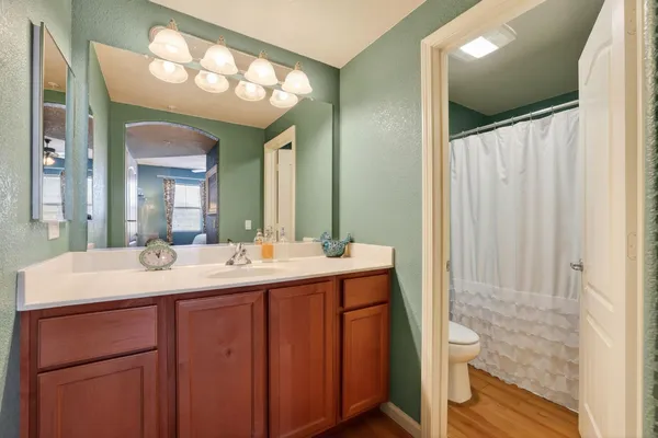 a bathroom with a double vanity sink and a mirror