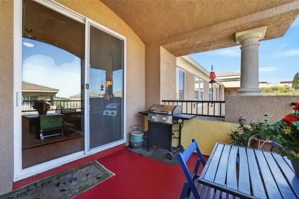 a view of balcony with furniture