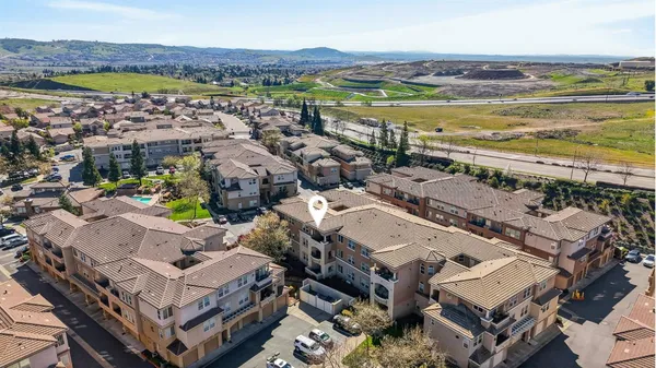 an aerial view of residential building with beach
