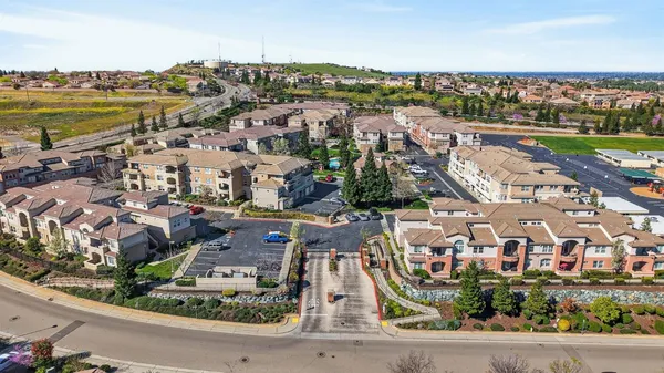 an aerial view of residential building and lake view