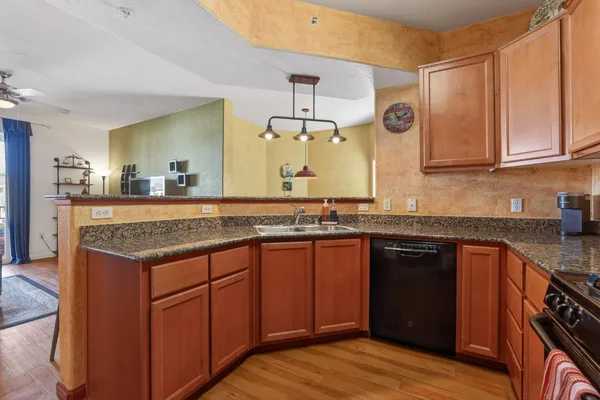 a kitchen with a sink and cabinets