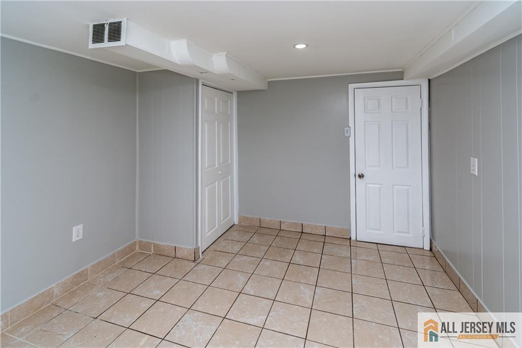 24 Old New Brunswick Road Piscataway, NJ 08854 - Photo 15 of 27 a view of an empty room and window