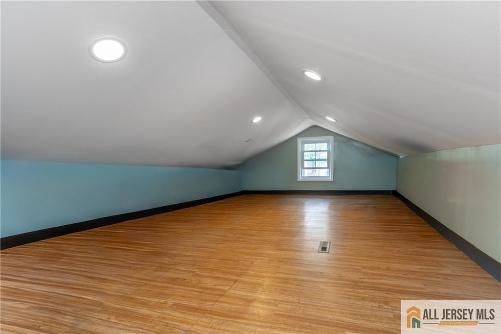 24 Old New Brunswick Road Piscataway, NJ 08854 - Photo 17 of 27 a view of an empty room with window and wooden floor