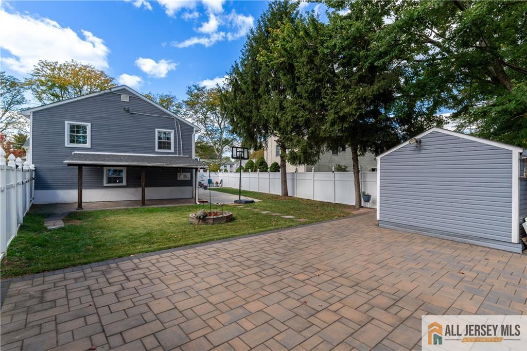 24 Old New Brunswick Road Piscataway, NJ 08854 - Photo 18 of 27 a front view of a house with a garden and trees