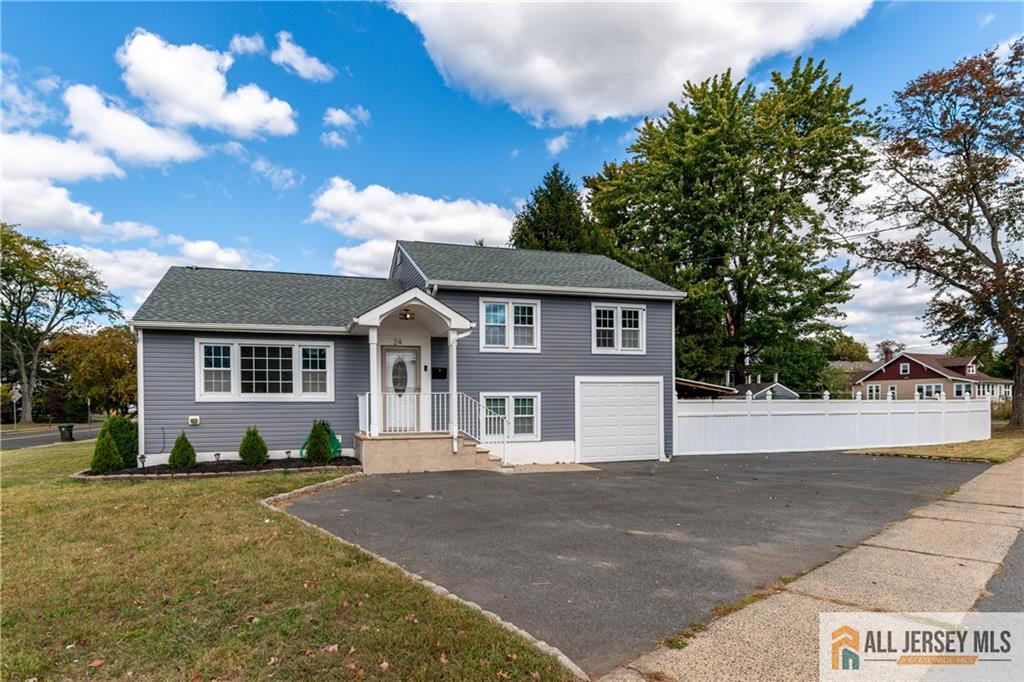 24 Old New Brunswick Road Piscataway, NJ 08854 - Photo 2 of 27 a front view of a house with a garden
