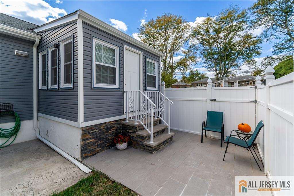 24 Old New Brunswick Road Piscataway, NJ 08854 - Photo 23 of 27 a view of a house with a yard and furniture