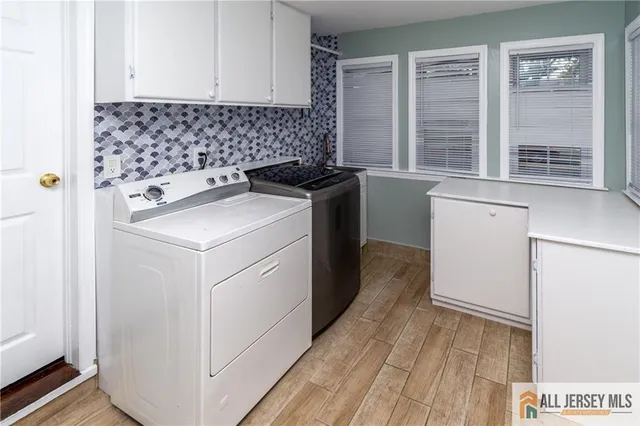 a utility room with dryer and washer
