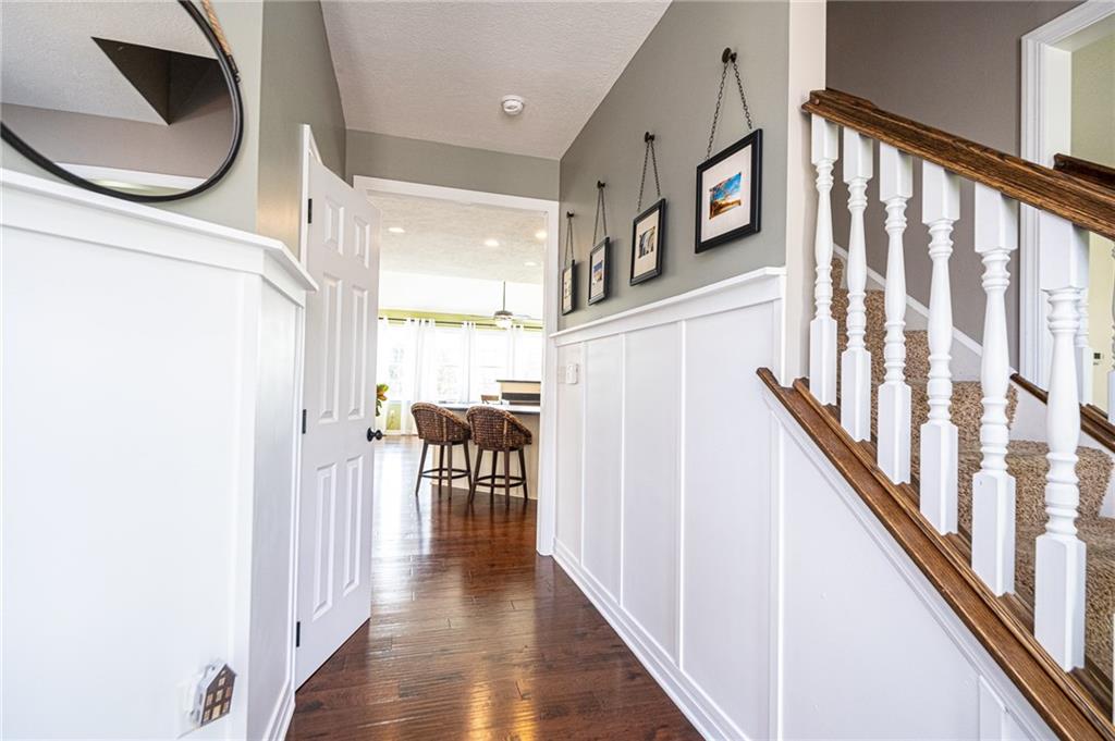132 Granite Ridge Circle Mars, PA 16046 - Photo 2 of 25 This home has a beautiful entry with custom board & batten wainscoting, 9 ft. ceilings, and stunning hardwood floors. Convenient powder room for guests off the hall-way.