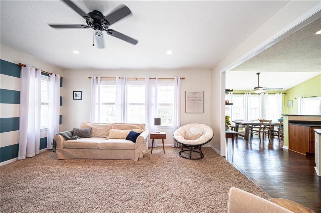 132 Granite Ridge Circle Mars, PA 16046 - Photo 13 of 25 This large family room was built with a 2 ft extension for added space! Notice the beautiful windows in both the family room and sun room!