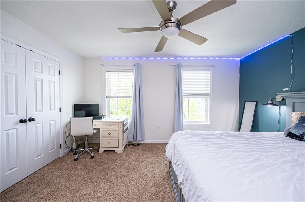 132 Granite Ridge Circle Mars, PA 16046 - Photo 22 of 25 This bedroom has lots of space measuring 15'x11'. Updated ceiling fan & lights and a large closet with added organization shelving.