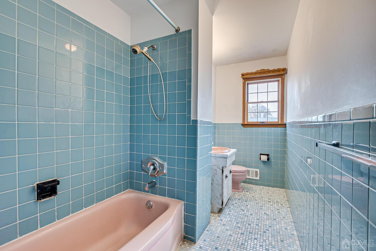 143 Princeton Road Old Bridge, NJ 08859 - Photo 27 of 32 a bathroom with a sink a toilet and bathtub