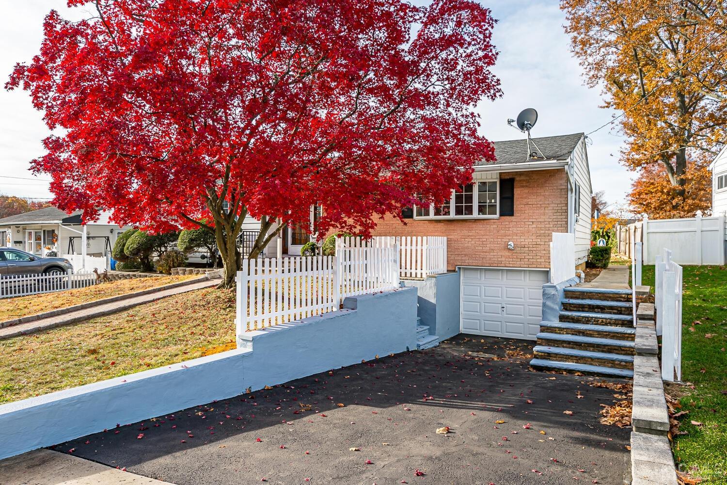 143 Princeton Road Old Bridge, NJ 08859 - Photo 3 of 32 a front view of a house with a yard and tree s