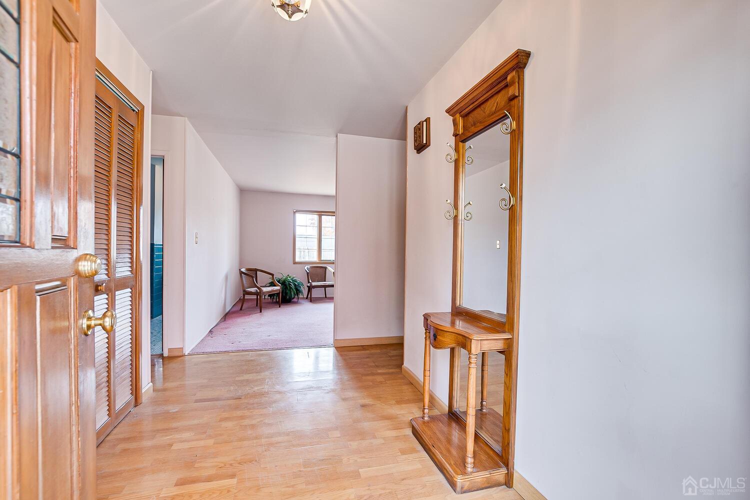 143 Princeton Road Old Bridge, NJ 08859 - Photo 7 of 32 a view of a hallway with furniture and entryway