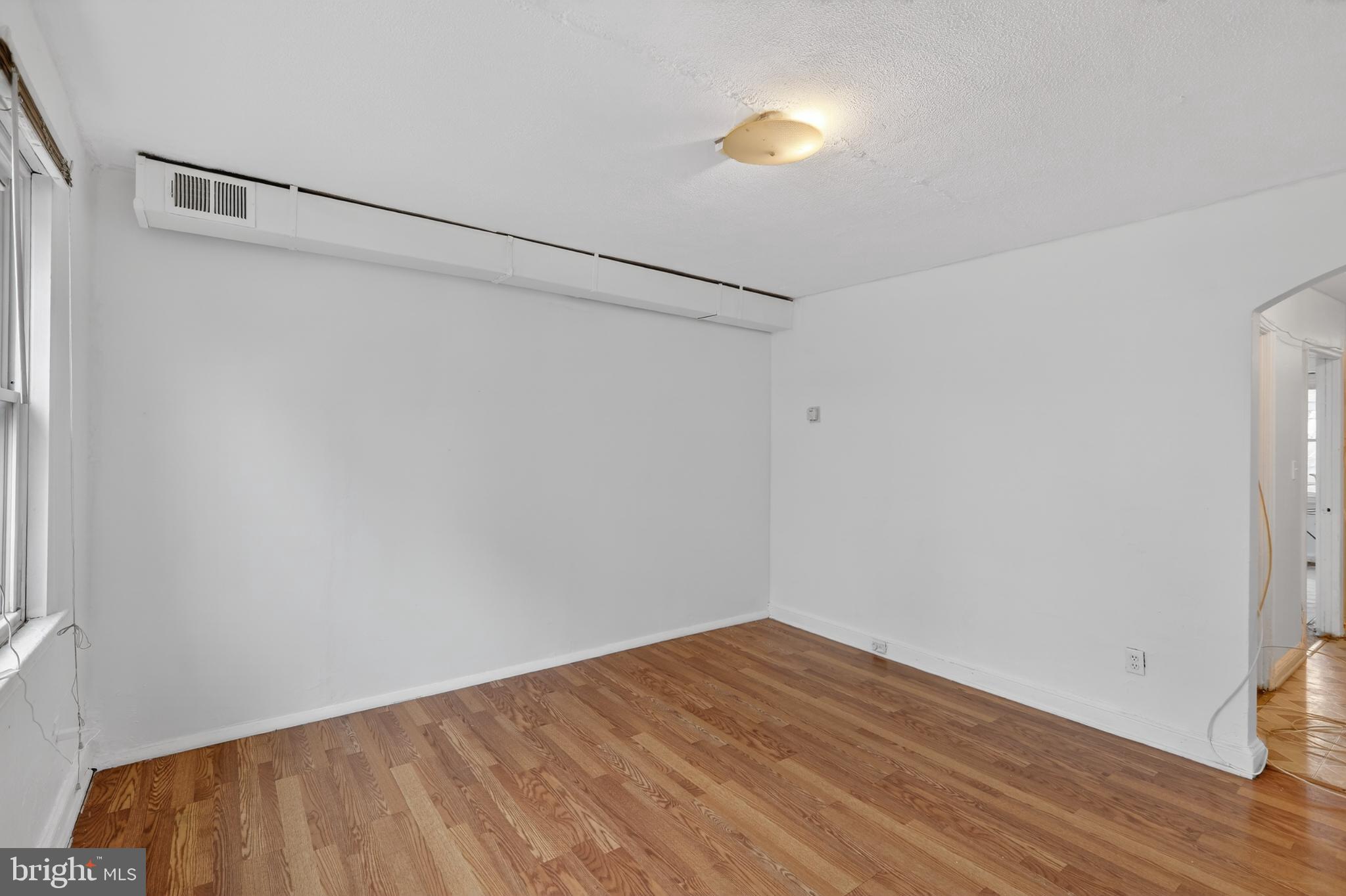 1711 H Street Northeast Washington, DC 20002 - Photo 14 of 15 a view of a room with wooden floor