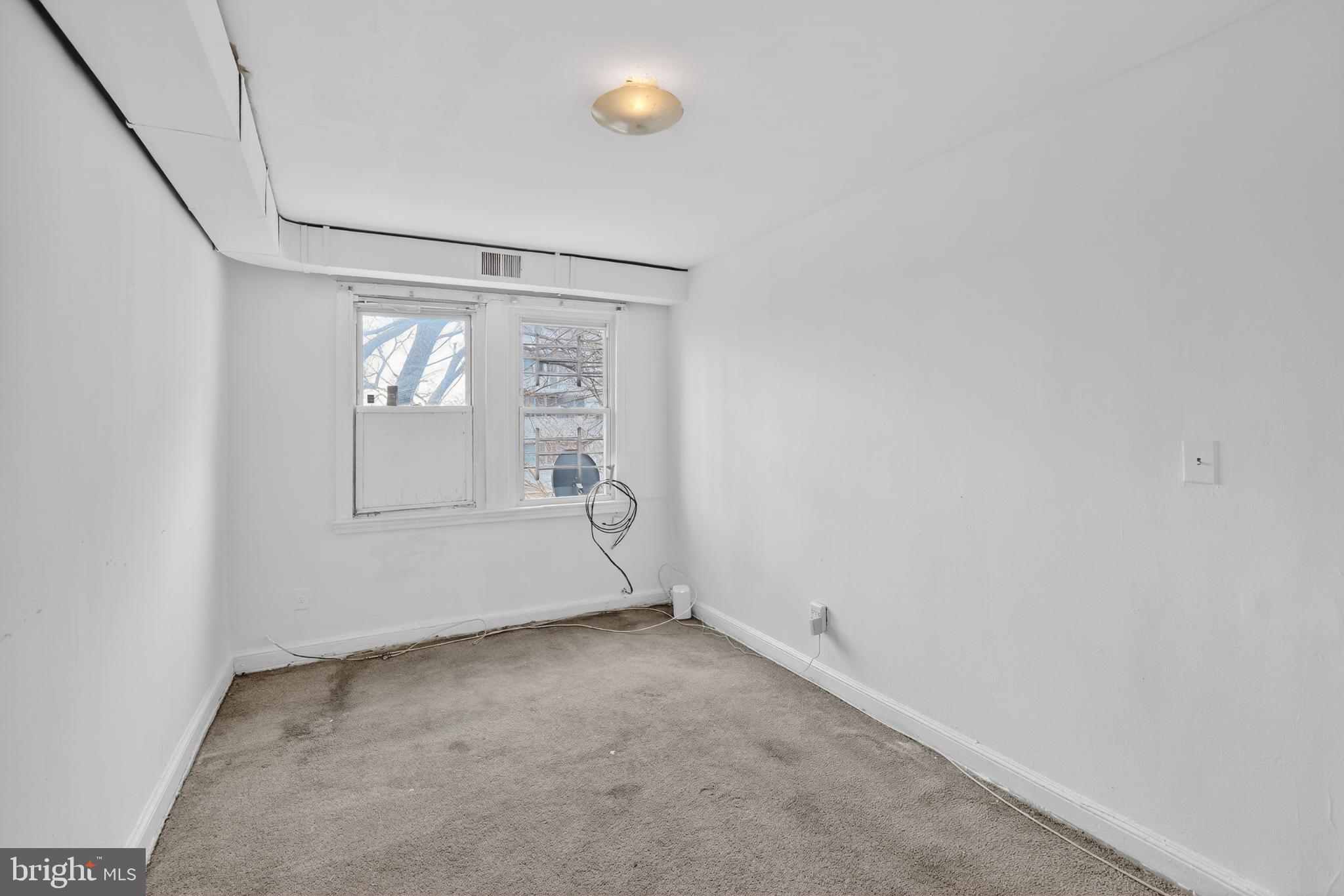 1711 H Street Northeast Washington, DC 20002 - Photo 9 of 15 an empty room with windows and closet