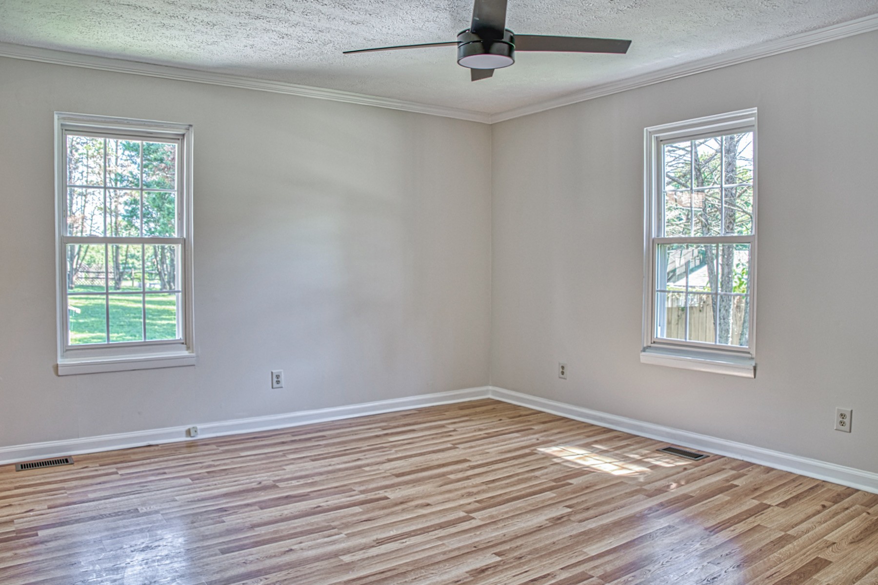 2085 Herbert Garrett Road Cookeville, TN 38506 - Photo 27 of 39 a view of empty room with wooden floor and fan