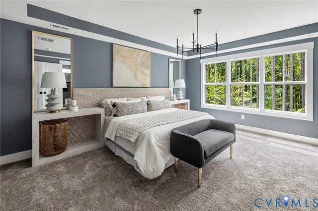 a spacious bedroom with a bed and a large window