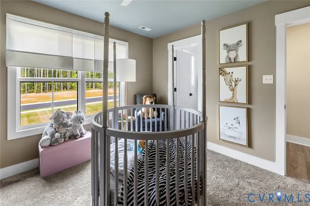 a view of a hallway with furniture and windows