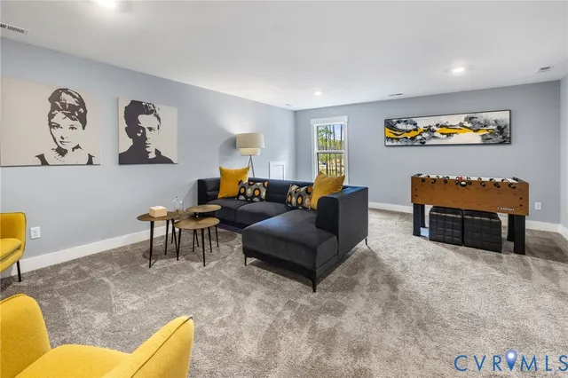 a living room with furniture and a rug