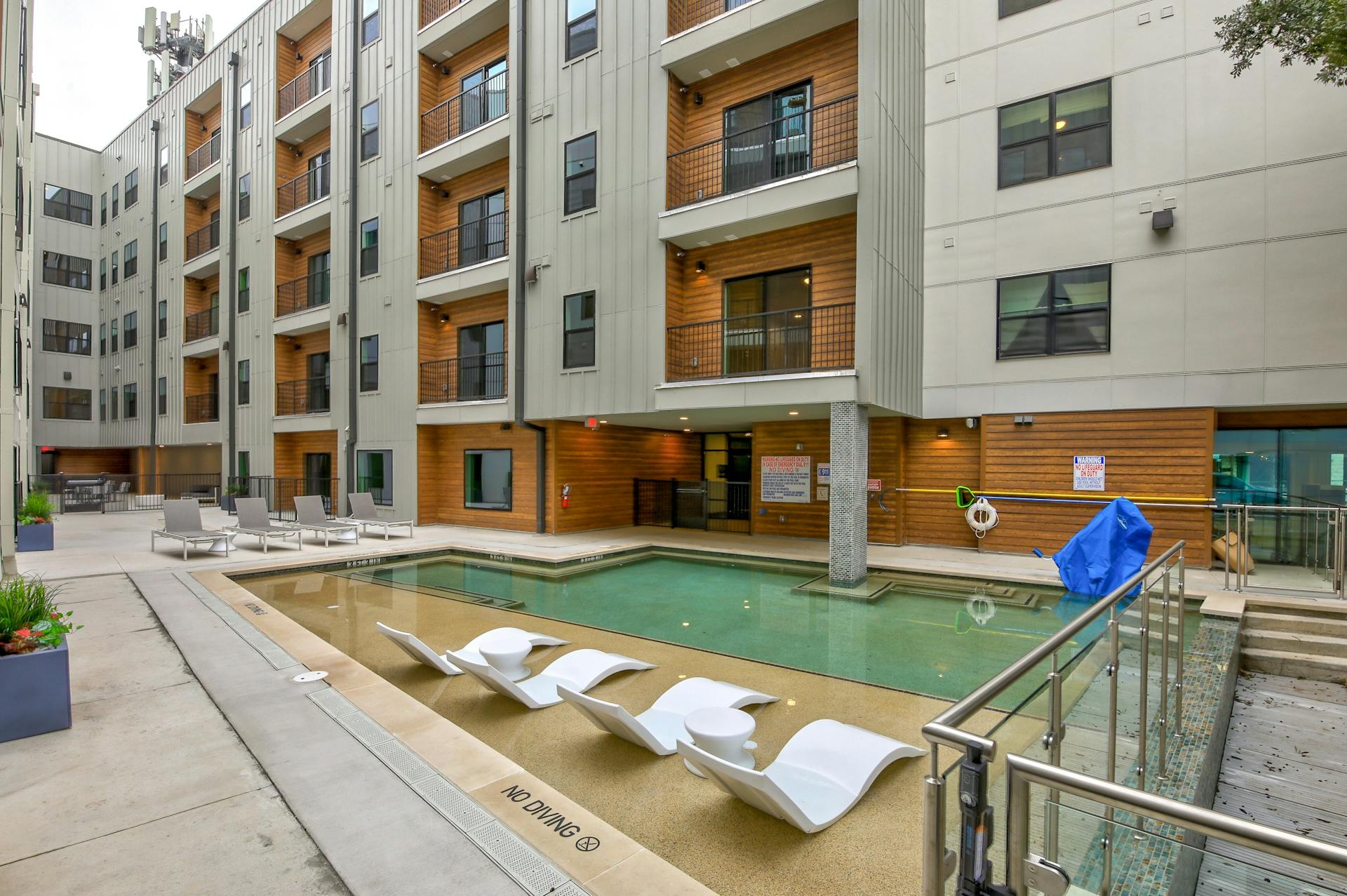 2500 Longview Street, Unit 501 Austin, TX 78705 - Photo 15 of 23 Community pool featuring a patio