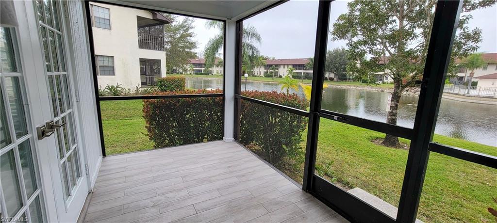 5367 Treetops Drive, Unit M101 Naples, FL 34113 - Photo 5 of 6 a view of balcony with a yard