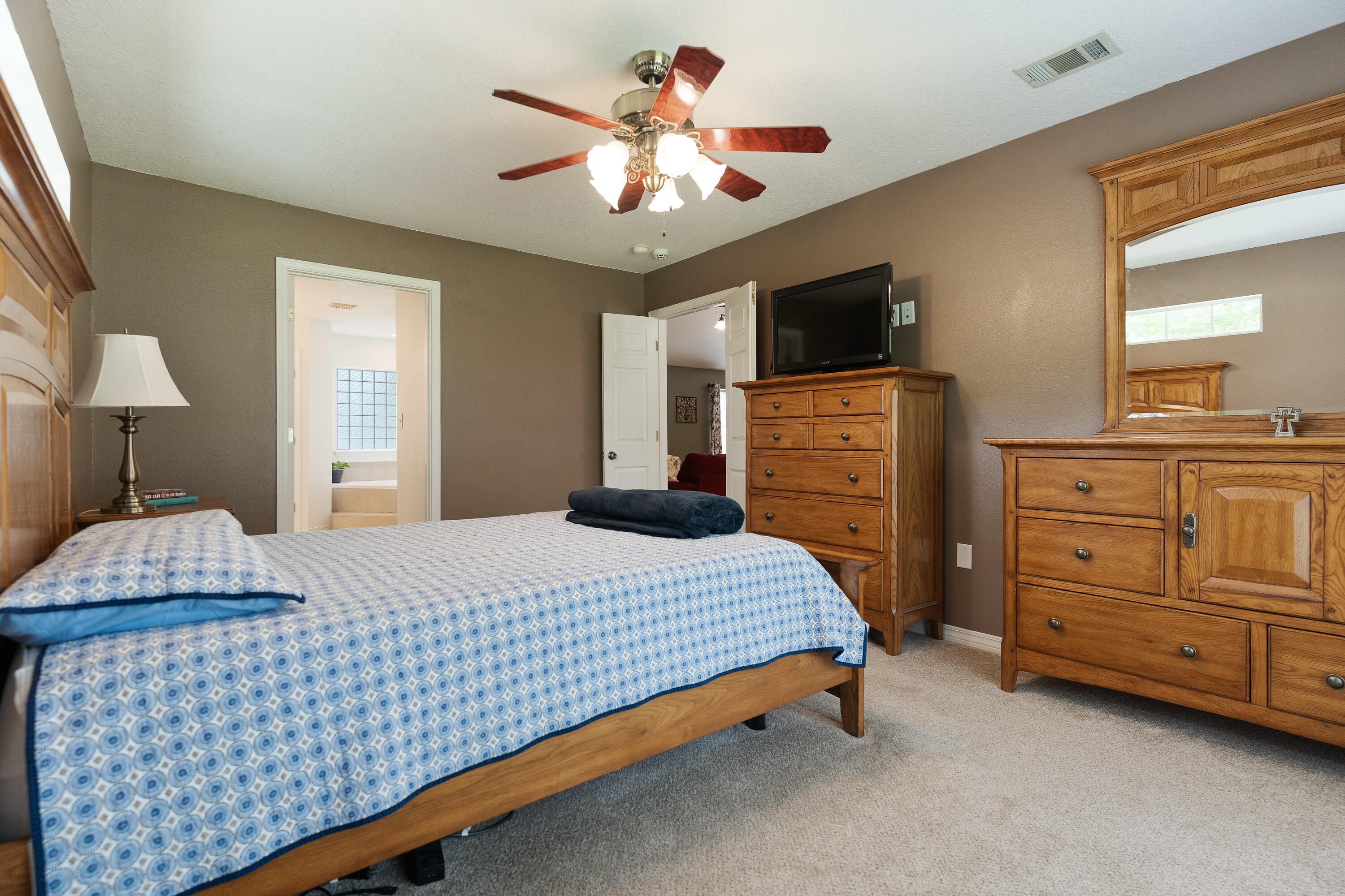 6100 Buckward Road Baker, FL 32531 - Photo 43 of 55 a bedroom with a bed and a dresser