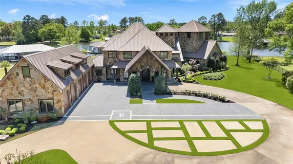 an aerial view of a house with a swimming pool