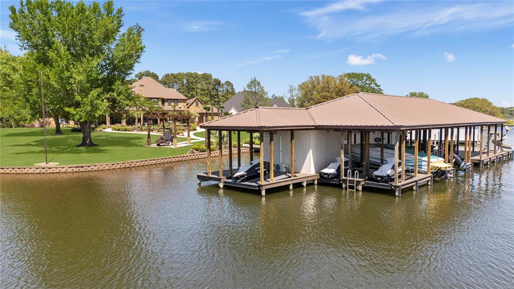 17873 Slack Road Whitehouse, TX 75791 - Photo 13 of 24 a view of a swimming pool with lawn chairs under an umbrella