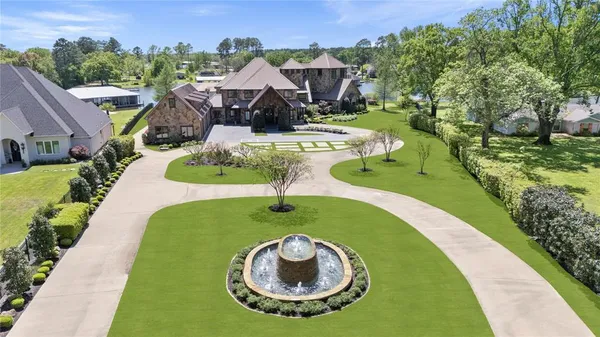 a view of a swimming pool with a yard