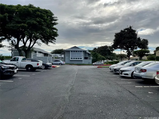 a view of street with parked cars
