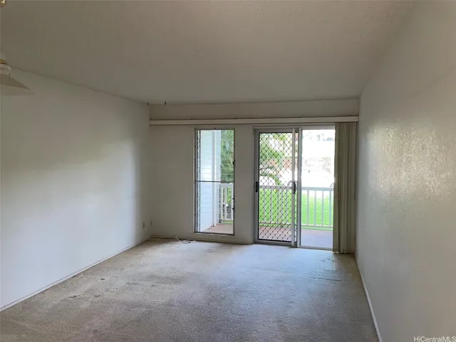 a view of a room that has a large window