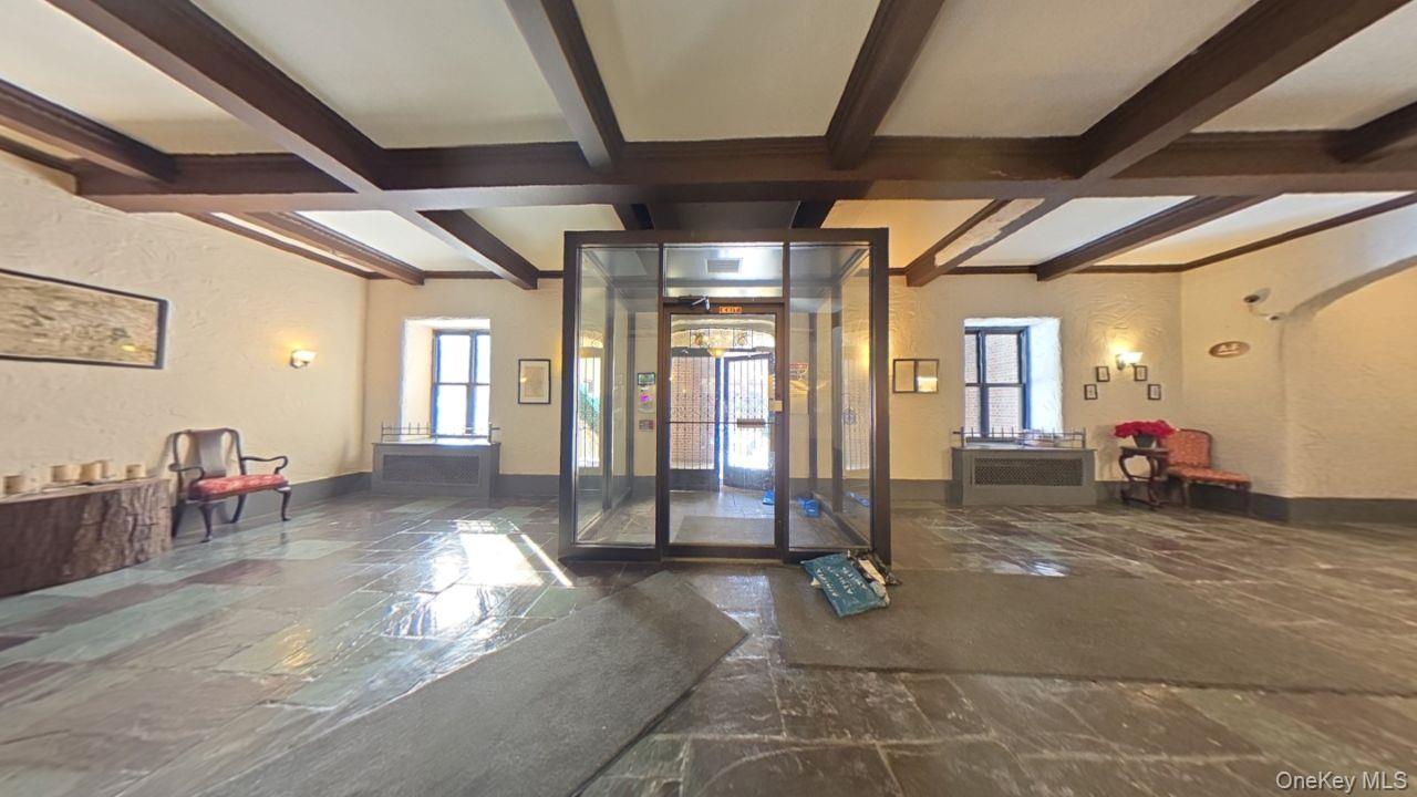 100 Pelham Road, Unit 2B New Rochelle, NY 10805 - Photo 1 of 13 a living room with furniture