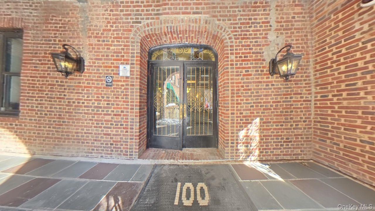 100 Pelham Road, Unit 2B New Rochelle, NY 10805 - Photo 2 of 13 a view of a brick wall with windows