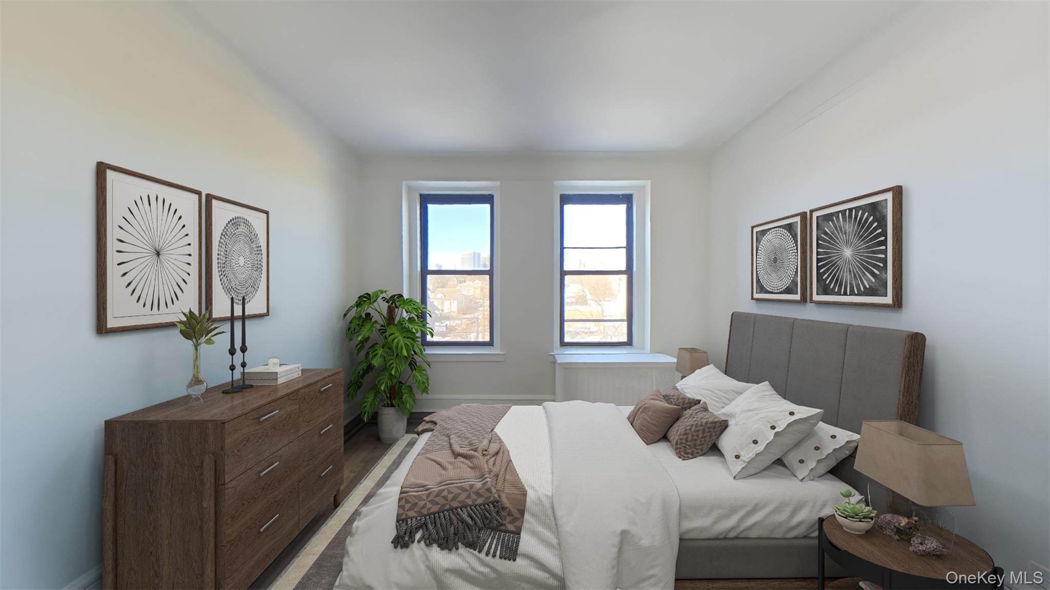 100 Pelham Road, Unit 2B New Rochelle, NY 10805 - Photo 5 of 13 a bedroom with a bed and a couch