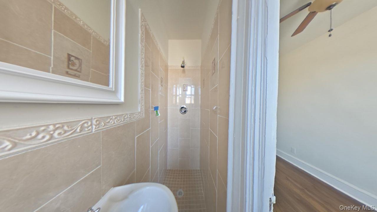 100 Pelham Road, Unit 2B New Rochelle, NY 10805 - Photo 10 of 13 a bathroom with a toilet and a shower
