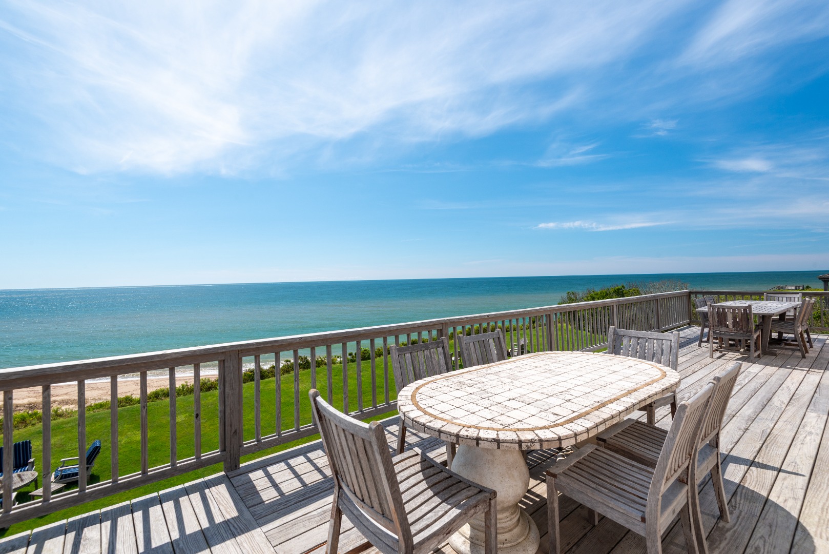 1 Reeds Way Nantucket, MA 02554 - Photo 13 of 51 a view of a balcony with a table and chairs