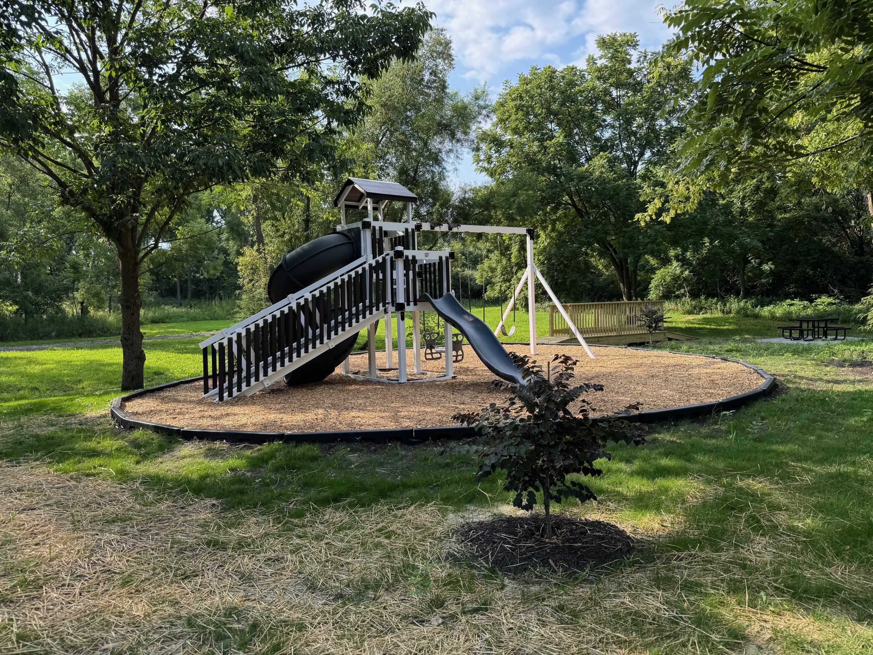 86 Bergamo Court Crown Point, IN 46307 - Photo 6 of 9 a view of a park with a slide