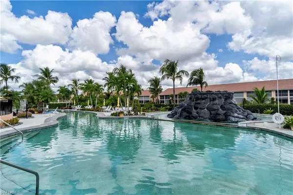 a view of a patio with a table and chairs
