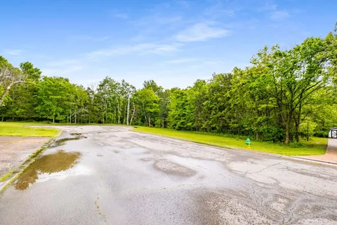 a view of a swimming pool with an outdoor space and seating area