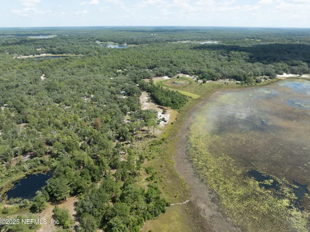 a view of a field with an ocean
